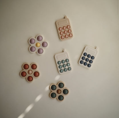 Mushie Phone Press Toy in Cambridge Blue