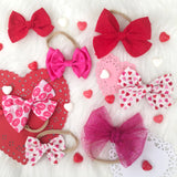 Scattered Glitter Hearts Bow